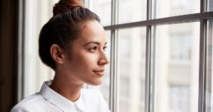 Thoughtful woman wondering about becoming pregnant again after an abortion.
